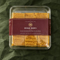 Besan Burfi in a clear box