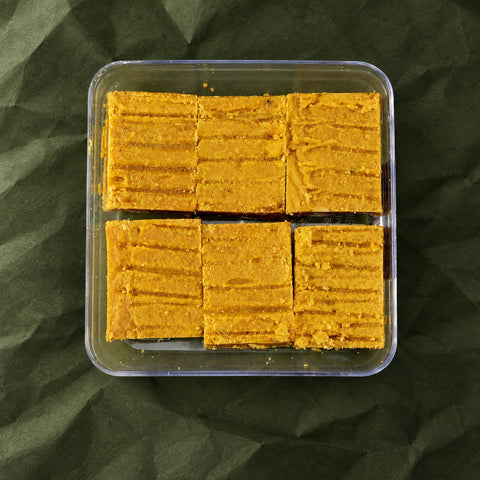 Besan Burfi in a clear box
