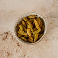 Long sultanas in a stoneware bowl