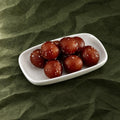 Mini Gulab Jamun on a plate