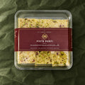 Pista Burfi in a clear box