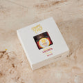 Pure Desi saffron threads gift box with window, viewed from above