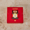 Pure Desi saffron jar seated in its red gift tray, printed The world's most precious spice