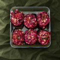 Rose Badaam Ladoo in a clear box