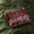 Rose Badaam Ladoo in a clear box